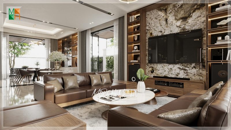 Bộ ghế sofa bọc da sáng bóng kết hợp với bàn trà mang tới sự hiện đại và tinh tế cho không gian sống của mọi gia đình Việt.